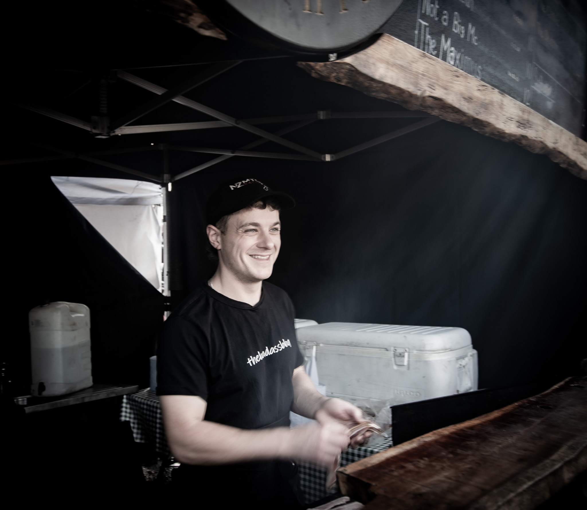 Alex in Badass BBQ tshirt grilling